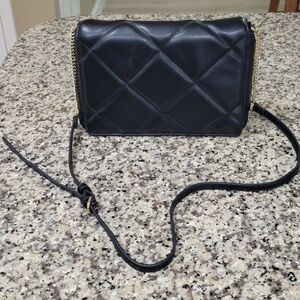 Black flip open, snap purse.